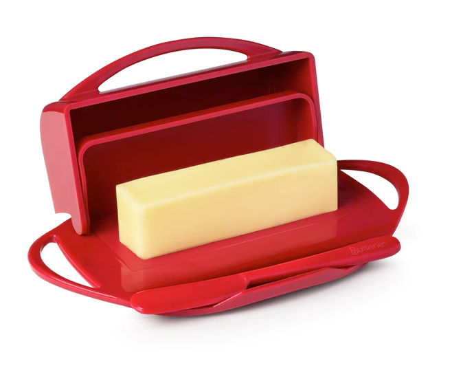Picture depicts a red butter dish with two side handles, the lid up, and a matching knife. 