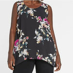Load image into Gallery viewer, This is a black tank with a flowy hem. The pattern is a bright floral pattern with lots of pink,  yellow, blue, and white.
