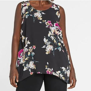 This is a black tank with a flowy hem. The pattern is a bright floral pattern with lots of pink,  yellow, blue, and white.