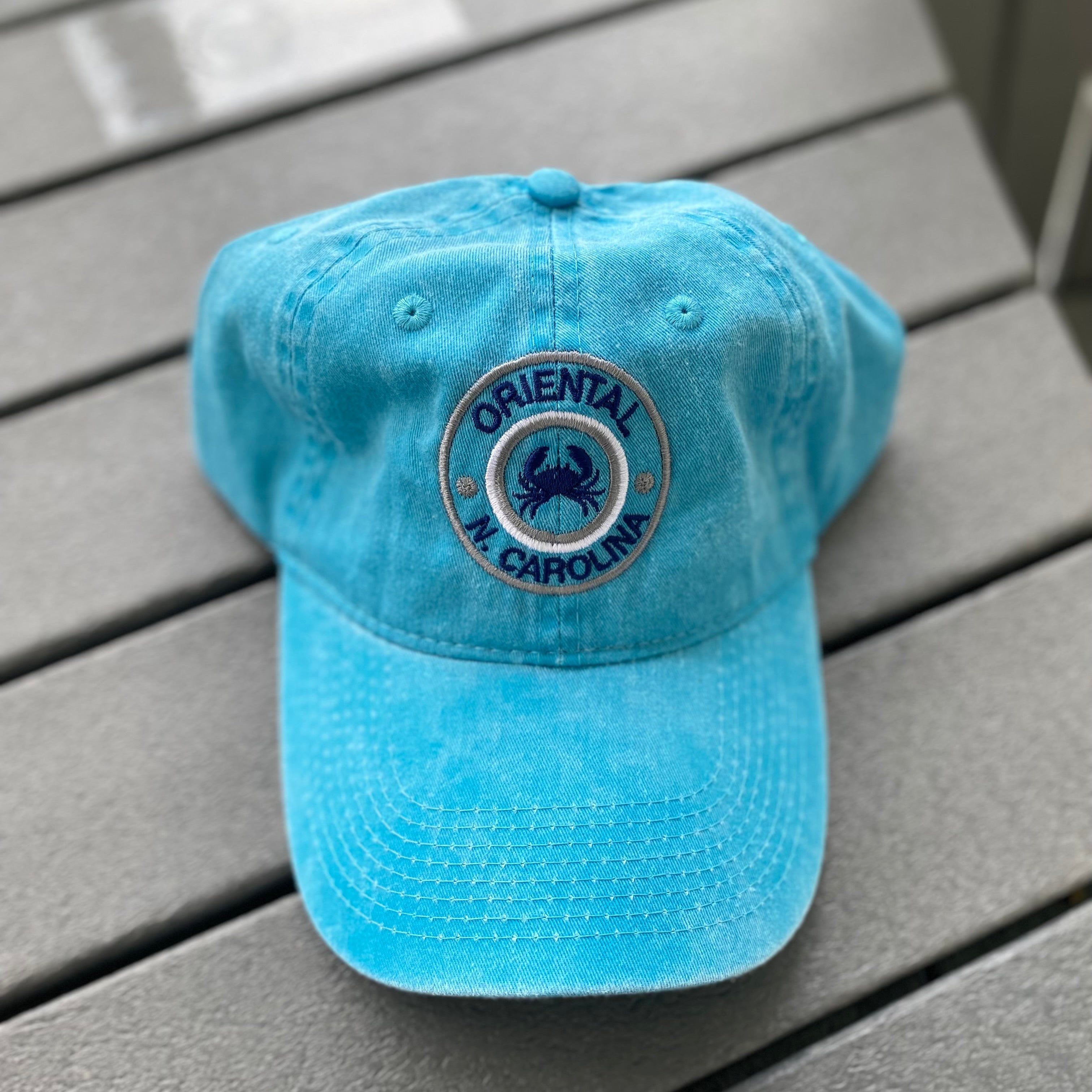 Aqua colored hat with crab and Oriental, N. Carolina