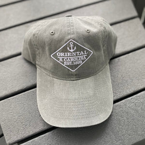 Light grey colored hat with anchor on it 