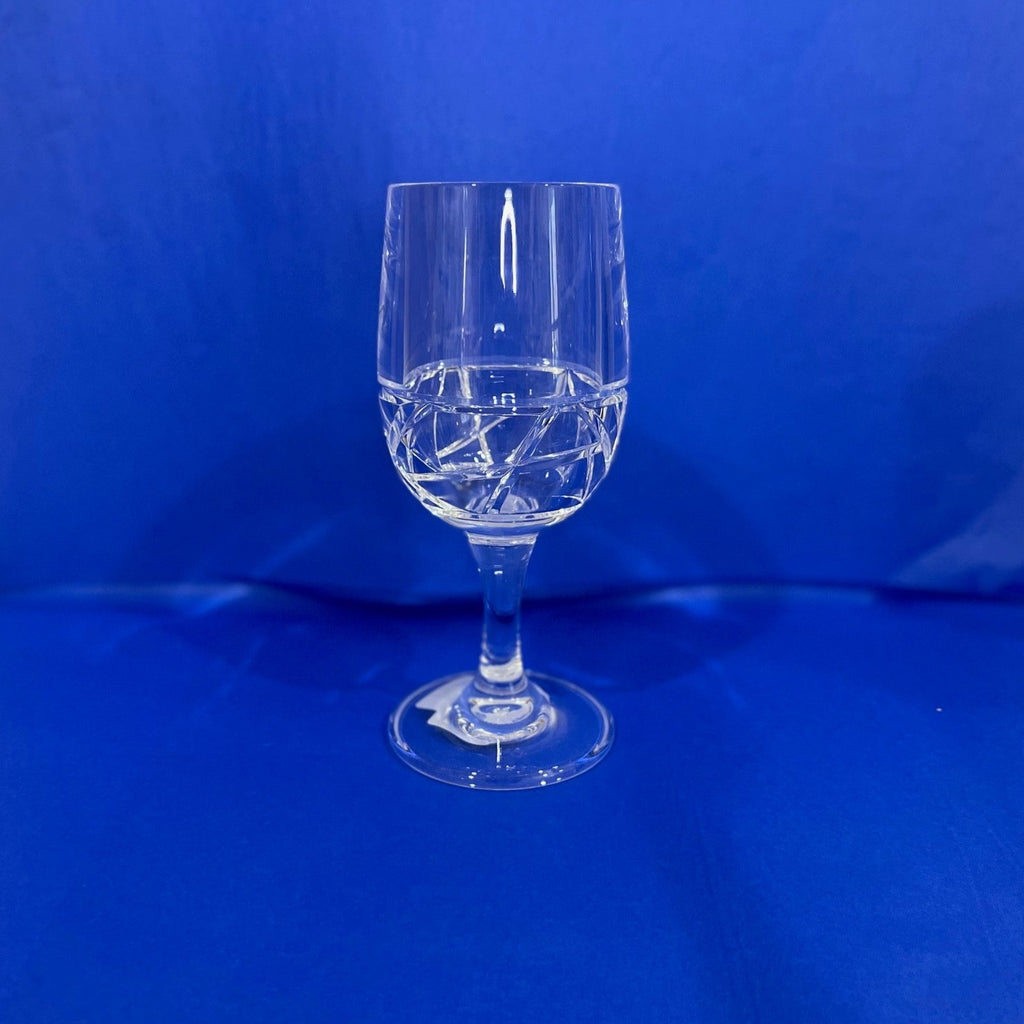 Clear stemmed wine glass with mosaic textured on bottom of cup. 