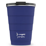 Load image into Gallery viewer, Picture depicts a navy tumbler with different size measuring ridges and a black lid.  Pirani logo is a small segmented whale. 
