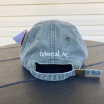 Load image into Gallery viewer, Olive green hat with Oriental North Carolina embroidered on the back of the hat.
