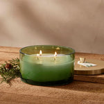 Load image into Gallery viewer, Light up the 4 Wick Candle by Thymes. It&#39;s the Fragrance of Christmas.
