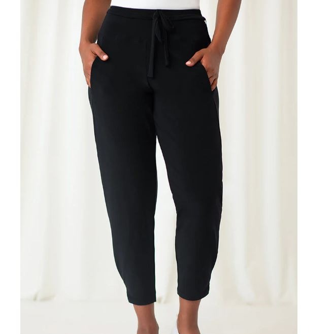 Black jogger pants with a belt made of the same material tied into a loose bow