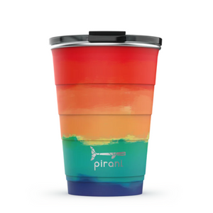 Picture depicts a painted rainbow ombre tumbler with different size measuring ridges and a black lid. Pirani logo is a small segmented whale.